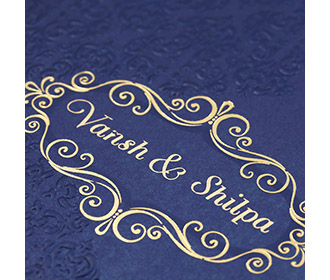 Multfaith Indian wedding card in royal blue & embossed floral motifs